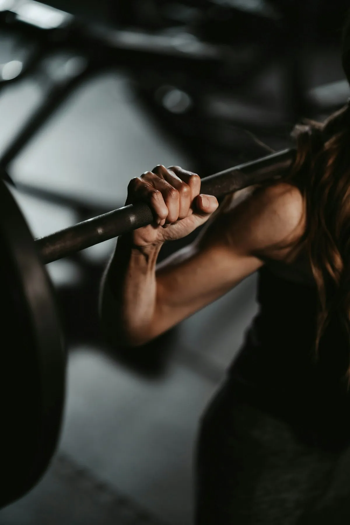 Hands chalked on a loaded barbell